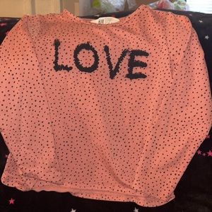 H&M Girls top with “Love” written burgundy/mauve with black specks, worn